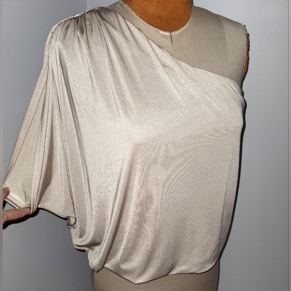 Jennifer Lopez one shoulder shimmery gold top